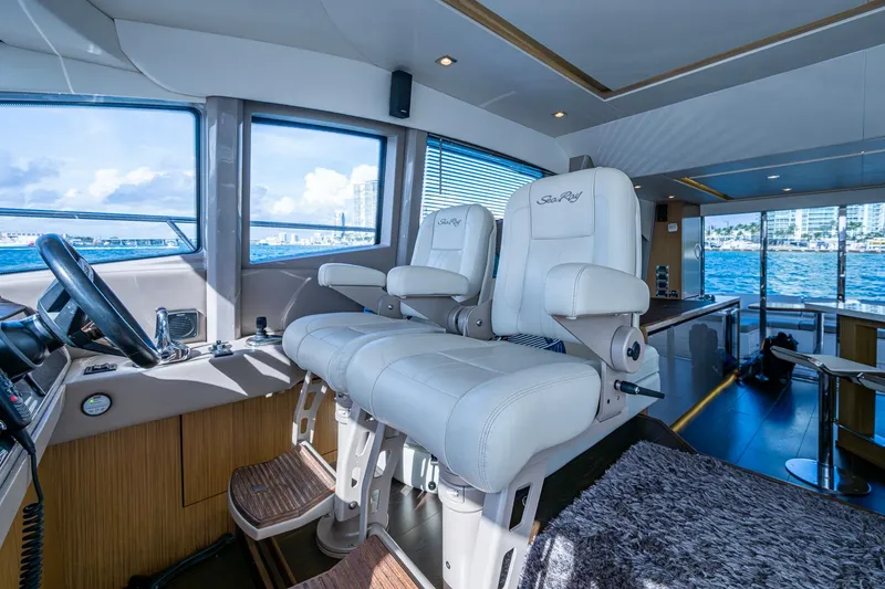 Slide: The Image of Luxurious interior of 2018 Sea Ray L550 Fly yacht with plush seating and ocean view. - 38