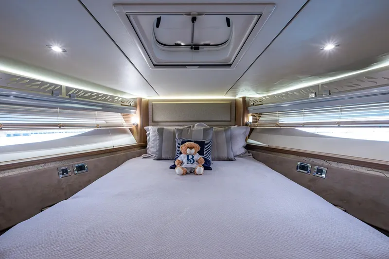 Slide: The Image of Luxurious bedroom interior of 2018 Sea Ray L550 Fly yacht with plush bedding. - 43