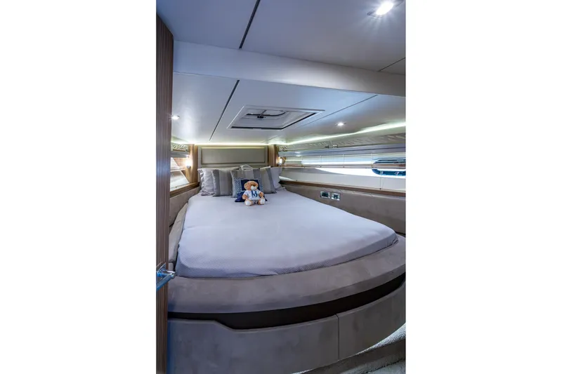 Slide: The Image of Luxurious bedroom interior of 2018 Sea Ray L550 Fly yacht with plush bedding. - 45