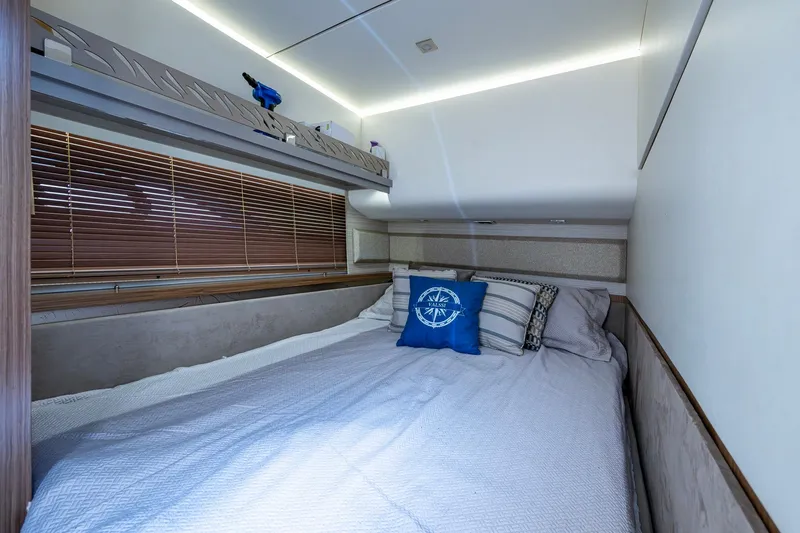 Slide: The Image of Luxurious bedroom interior of 2018 Sea Ray L550 Fly yacht with cozy bedding and nautical decor. - 47