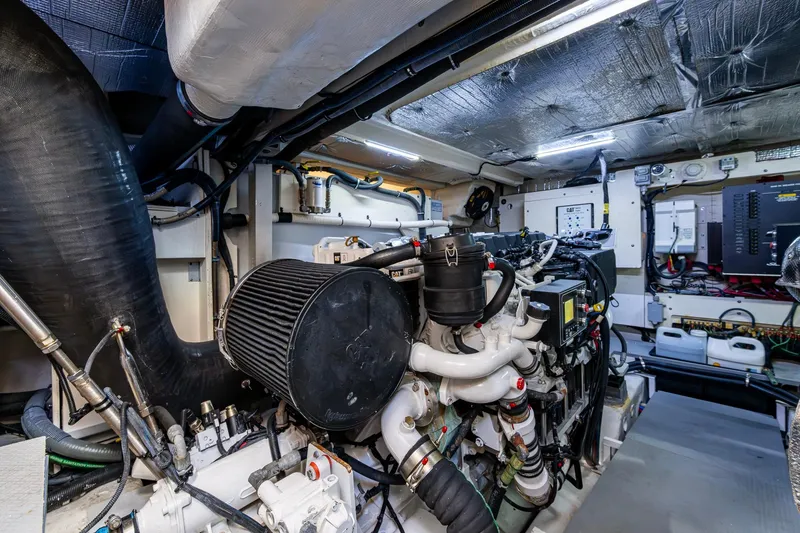 Slide: The Image of Engine room of 2018 Sea Ray L550 Fly yacht, showcasing complex machinery and components. - 60