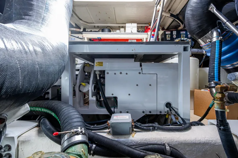 Slide: The Image of Engine room of 2018 Sea Ray L550 Fly yacht, showcasing mechanical components and systems. - 62