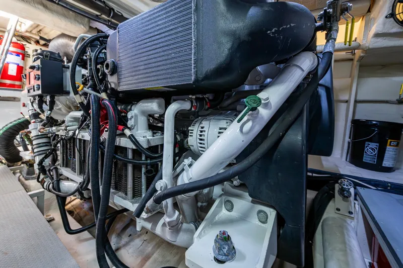 Slide: The Image of Engine room of 2018 Sea Ray L550 Fly yacht, showcasing detailed mechanical components. - 64