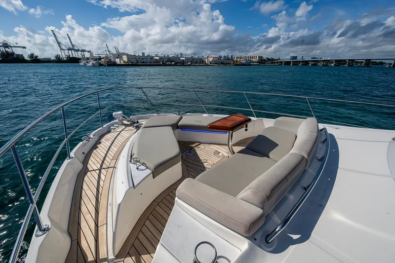 Slide: The Image of Luxurious 2018 Sea Ray L550 Fly yacht with elegant deck seating and ocean view. - 7