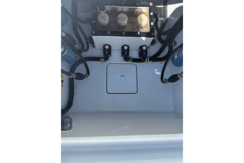 Slide: The Image of 2022 Contender 39 ST boat interior showing engine compartment and wiring. - 19