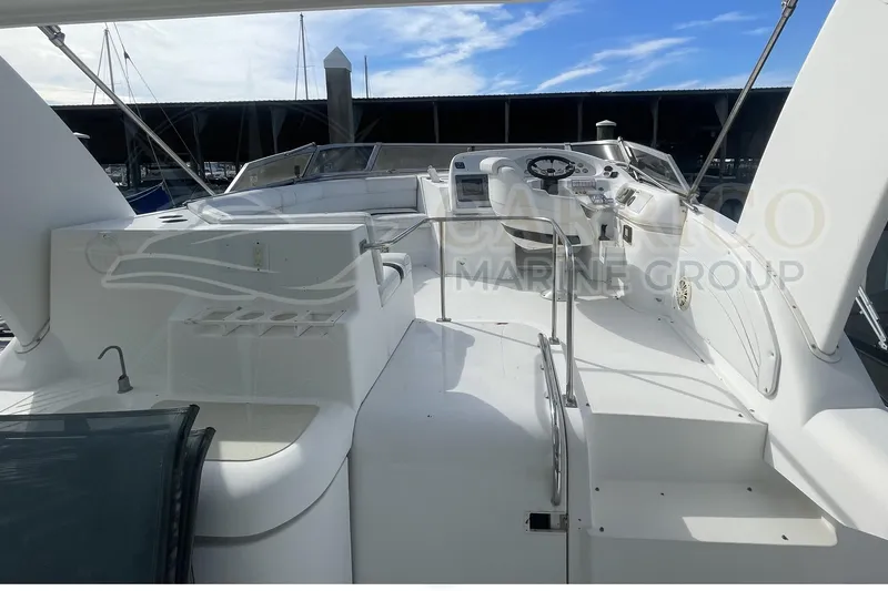 Slide: The Image of 1996 Cruisers Yachts 3650 Aft Cabin boat interior with helm and seating area. - 15