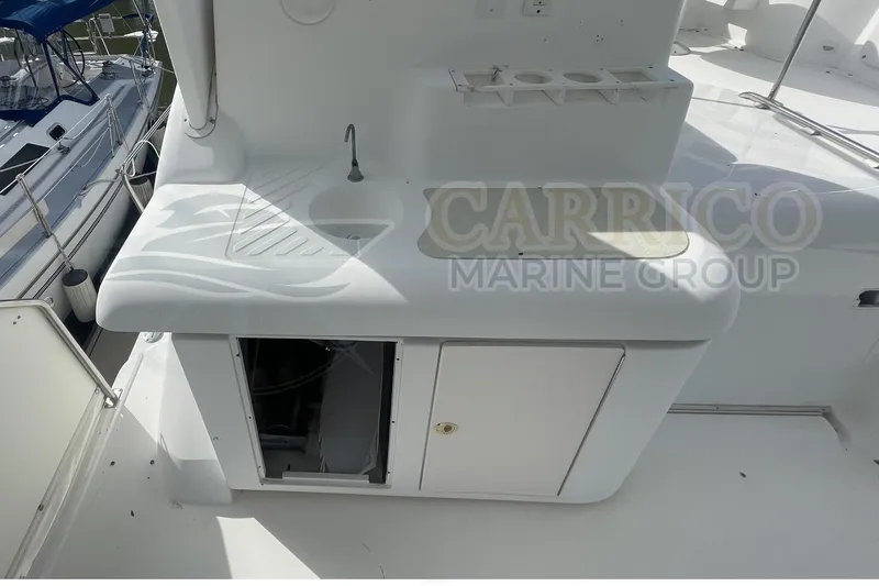 Slide: The Image of 1996 Cruisers Yachts 3650 Aft Cabin with outdoor sink and storage area. - 19