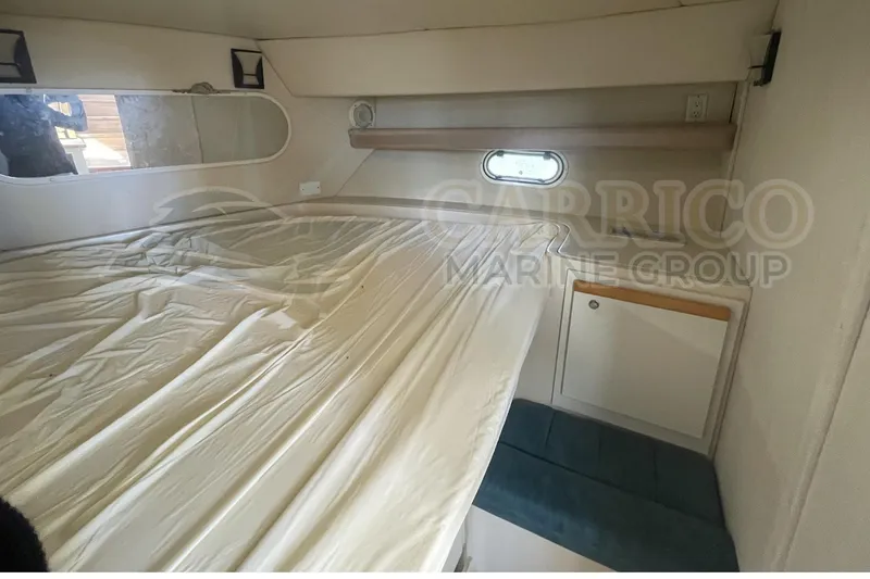 Slide: The Image of 1996 Cruisers Yachts 3650 Aft Cabin interior with bed and storage cabinet. - 31