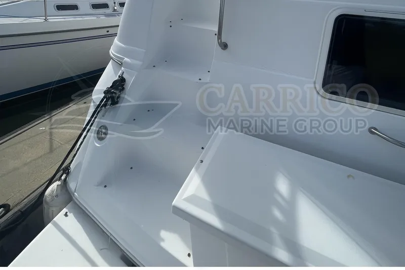 Slide: The Image of 1996 Cruisers Yachts 3650 Aft Cabin, white exterior, docked at marina. - 11
