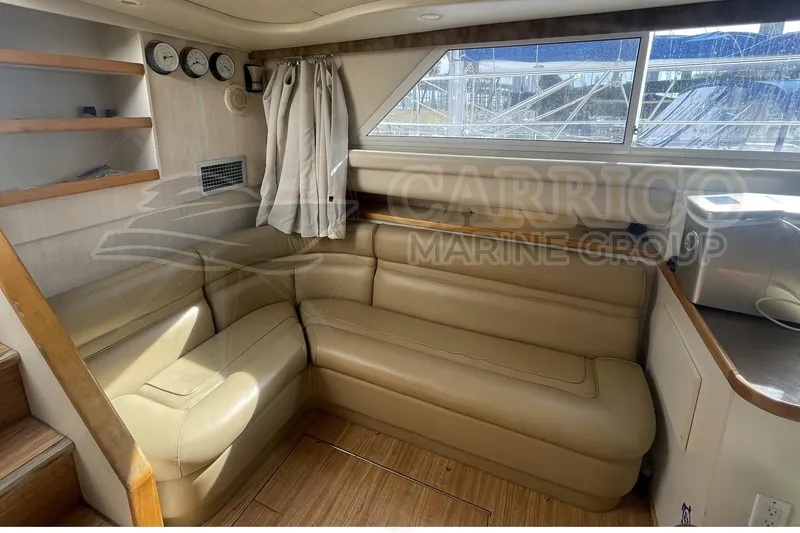 Slide: The Image of Interior of 1996 Cruisers Yachts 3650 Aft Cabin with beige seating and wood accents. - 22