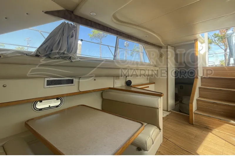 Slide: The Image of Interior of 1996 Cruisers Yachts 3650 Aft Cabin with dining area and stairs. - 23