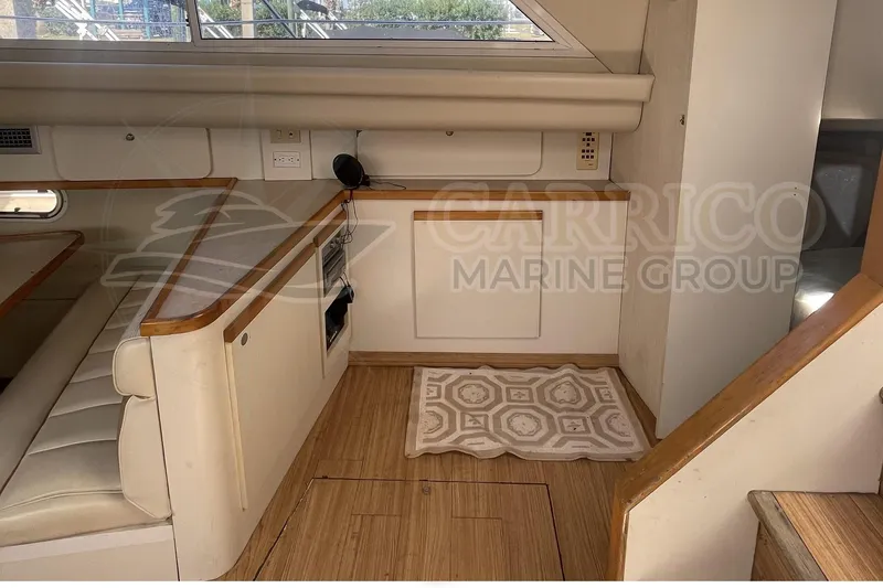 Slide: The Image of Interior of 1996 Cruisers Yachts 3650 Aft Cabin with wood flooring and seating area. - 25