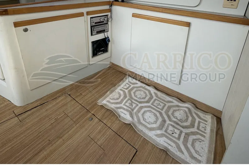 Slide: The Image of 1996 Cruisers Yachts 3650 Aft Cabin interior with wood flooring and built-in stereo system. - 29