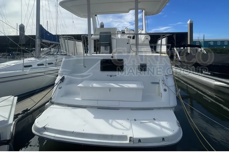 Slide: The Image of 1996 Cruisers Yachts 3650 Aft Cabin docked at marina, rear view. - 3