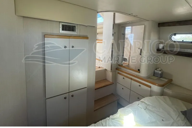 Slide: The Image of 1996 Cruisers Yachts 3650 Aft Cabin interior with cabinetry and steps. - 33