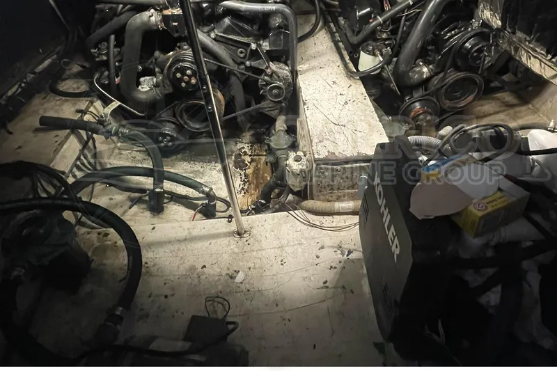 Slide: The Image of Engine room of 1996 Cruisers Yachts 3650 Aft Cabin with visible mechanical components. - 37