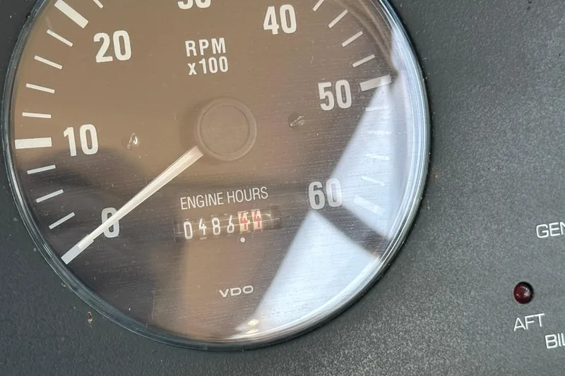 Slide: The Image of 2001 Tiara Yachts 3500 Open cockpit with steering wheel, controls, and cabin entrance. - 17