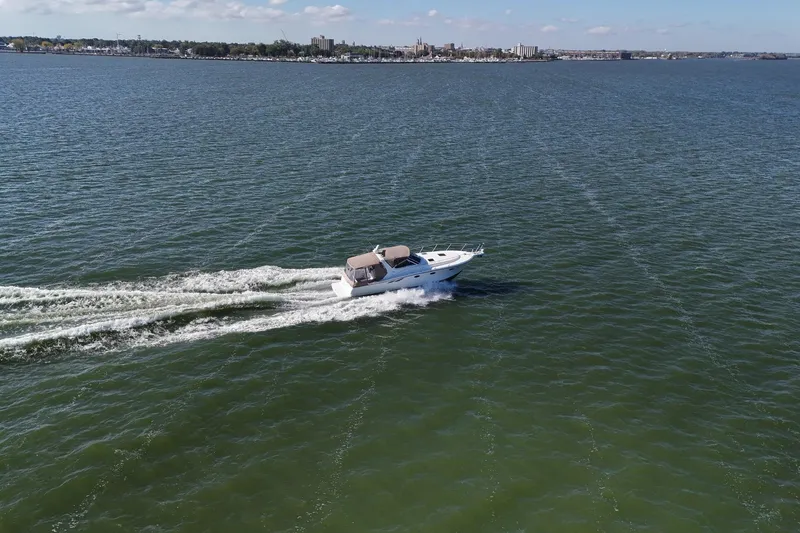 Slide: The Image of Luxurious cabin interior of 2001 Tiara Yachts 3500 Open with cozy bedding. - 29