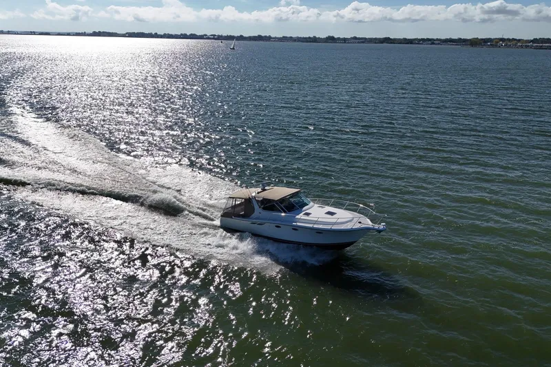 Slide: The Image of 2001 Tiara Yachts 3500 Open cruising on a sunny day in open waters. - 32