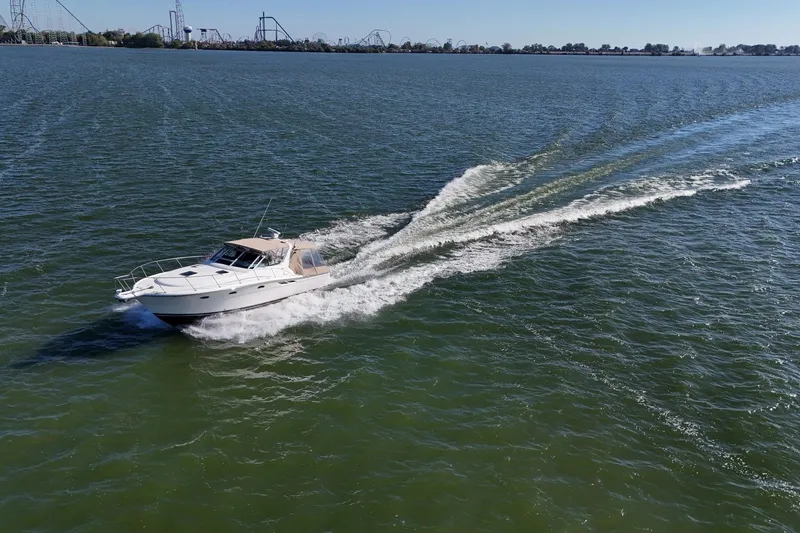 Slide: The Image of 2001 Tiara Yachts 3500 Open cruising on a sunny, sparkling sea. - 33