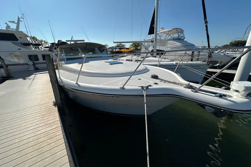 Slide: The Image of 2001 Tiara Yachts 3500 Open cruising on a sunny lake. - 5