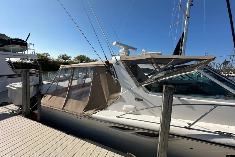 Slide: The Image of 2001 Tiara Yachts 3500 Open cruising on calm green waters. - 6