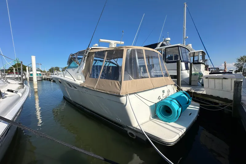 Slide: The Image of Aerial view of 2001 Tiara Yachts 3500 Open on calm green water. - 7