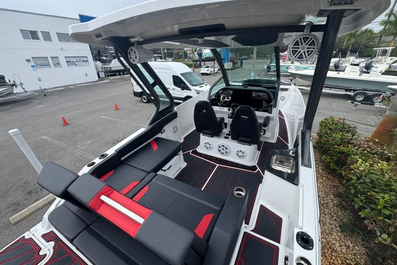 Slide: The Image of 2025 Monterey Elite 27 OB boat interior with modern seating and dashboard design. - 11