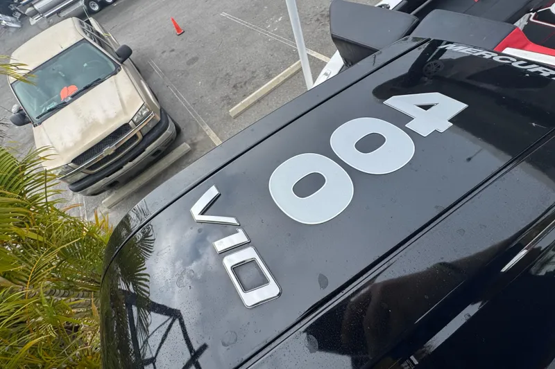 Slide: The Image of Close-up of a 2025 Monterey Elite 27 OB boat engine with V10 400 branding. - 13