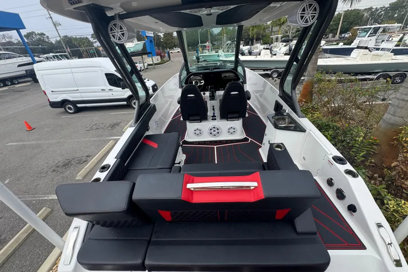 Slide: The Image of 2025 Monterey Elite 27 OB boat interior with modern seating and sleek design. - 14