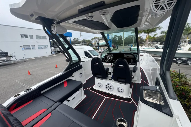 Slide: The Image of 2025 Monterey Elite 27 OB boat interior with modern seating and sleek design. - 17