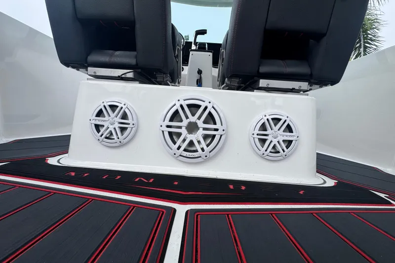 Slide: The Image of 2025 Monterey Elite 27 OB boat interior with JL Audio speakers and stylish seating. - 18
