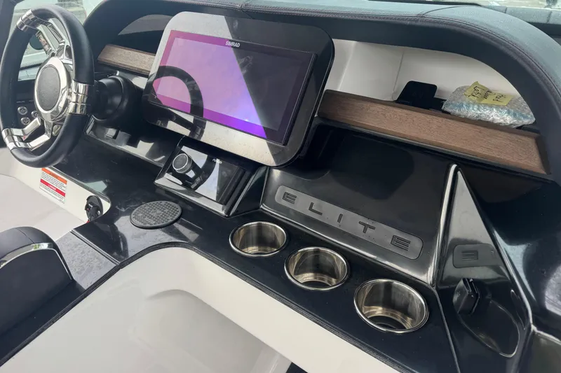 Slide: The Image of 2025 Monterey Elite 27 OB dashboard with steering wheel and touchscreen display. - 23