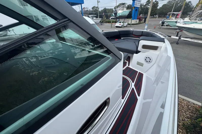 Slide: The Image of 2025 Monterey Elite 27 OB boat with sleek design and modern seating. - 26