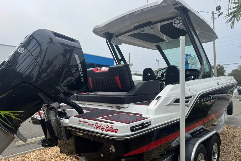 Slide: The Image of 2025 Monterey Elite 27 OB boat with Mercury engine, sleek design, and modern features. - 8