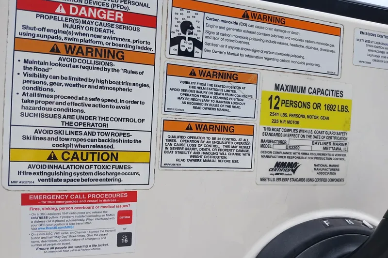 Slide: The Image of Safety warnings and capacity limits on a 2023 Bayliner DX 2200 boat. - 15