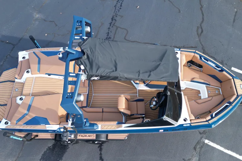 Slide: The Image of 2024 Nautique Super Air Nautique S21 boat, top view, showcasing sleek design and spacious interior. - 20