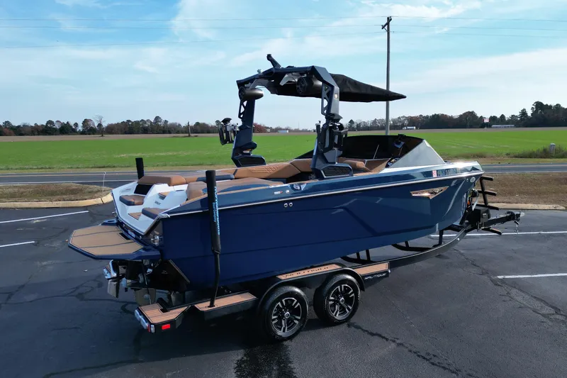 Slide: The Image of 2024 Nautique Super Air Nautique S21 boat on trailer, parked outdoors. - 5