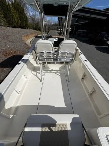 Slide: The Image of 2025 Bulls Bay 255CC boat interior with dual seats and spacious deck. - 4