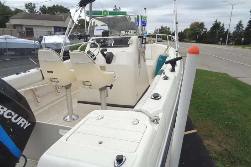 Slide: The Image of 2001 Sea Master 2080 Center Console boat with Mercury engine, parked near a road. - 13
