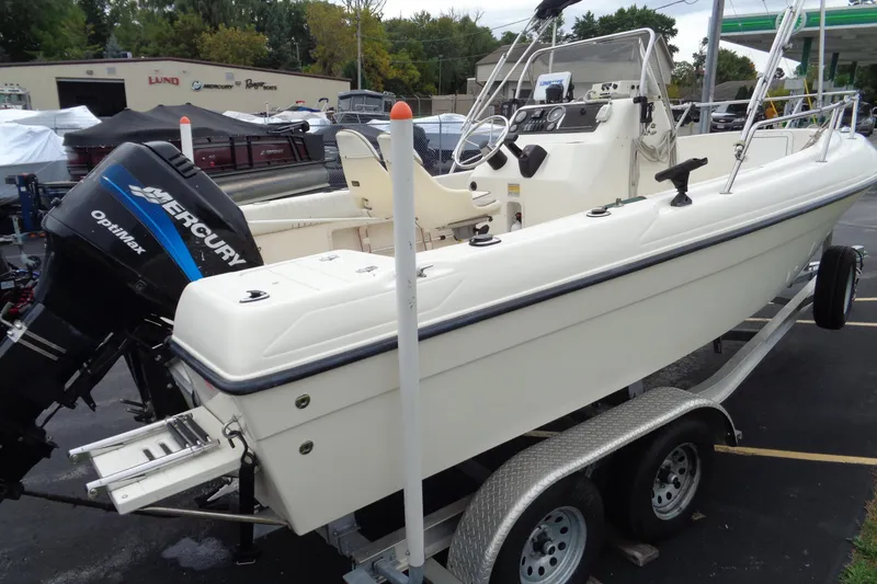 Slide: The Image of 2001 Sea Master 2080 Center Console boat with Mercury Optimax engine on trailer. - 14