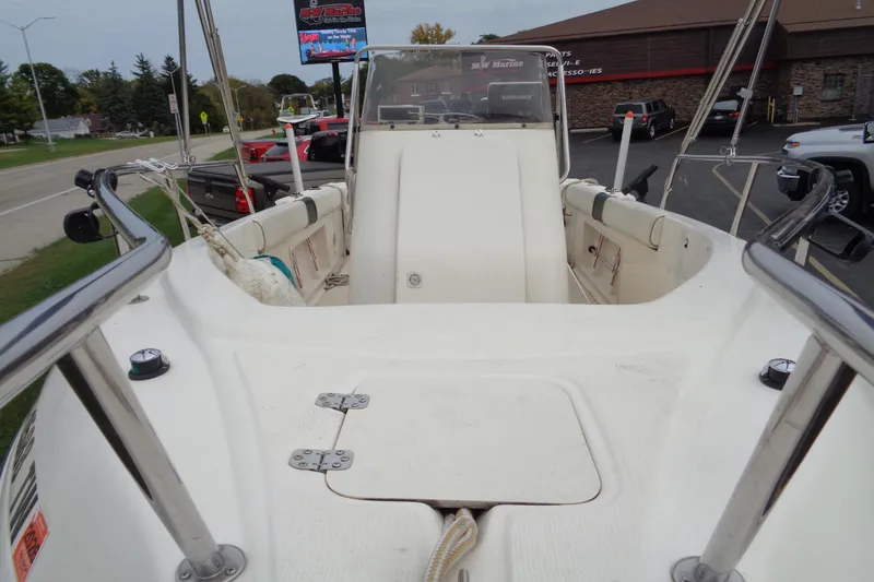 Slide: The Image of 2001 Sea Master 2080 Center Console boat, parked outdoors, showcasing interior and console. - 21