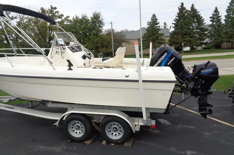 Slide: The Image of 2001 Sea Master 2080 Center Console boat on trailer with dual outboard motors. - 3