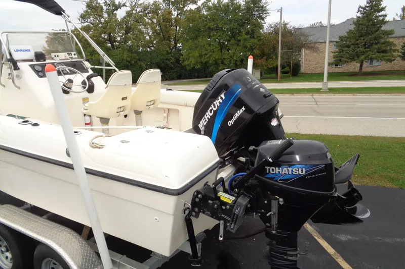 Slide: The Image of 2001 Sea Master 2080 Center Console boat with Mercury and Tohatsu engines on a trailer. - 4