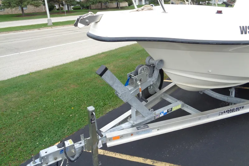 Slide: The Image of 2001 Sea Master 2080 Center Console boat on Load Rite trailer, parked on grass. - 7