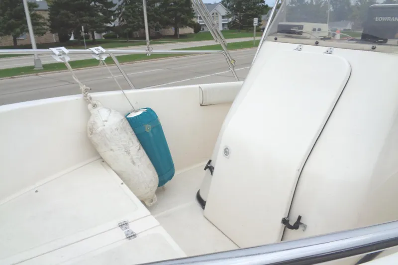Slide: The Image of 2001 Sea Master 2080 Center Console boat interior with fenders and storage compartment. - 8