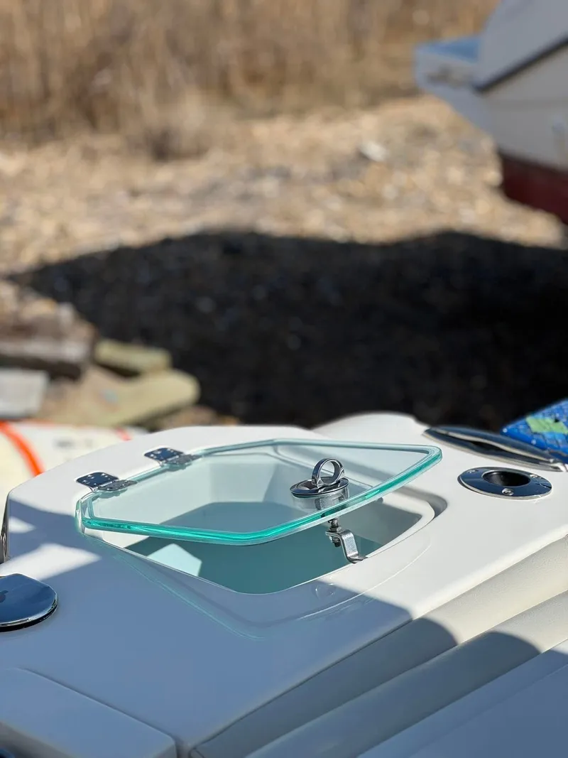 Slide: The Image of Open hatch on 2023 Sailfish 276DC boat, showcasing sleek design and functionality. - 9