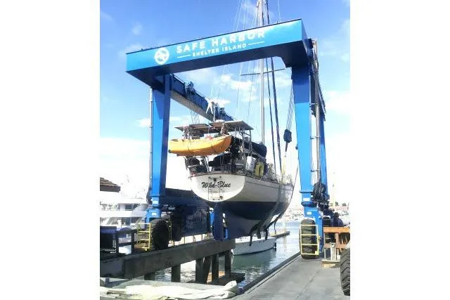 Slide: The Image of 1999 Island Packet 45 sailboat lifted at Safe Harbor Shelter Island marina. - 59