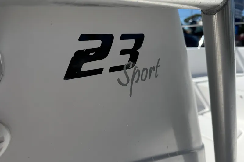 Slide: The Image of Close-up of 2006 PROLINE 23 Sport boat logo on white surface. - 24