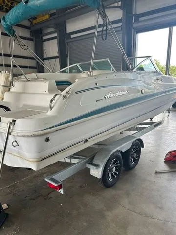 Slide: The Image of 2000 Hurricane SunDeck SD 237 OB boat on trailer in indoor storage facility. - 6